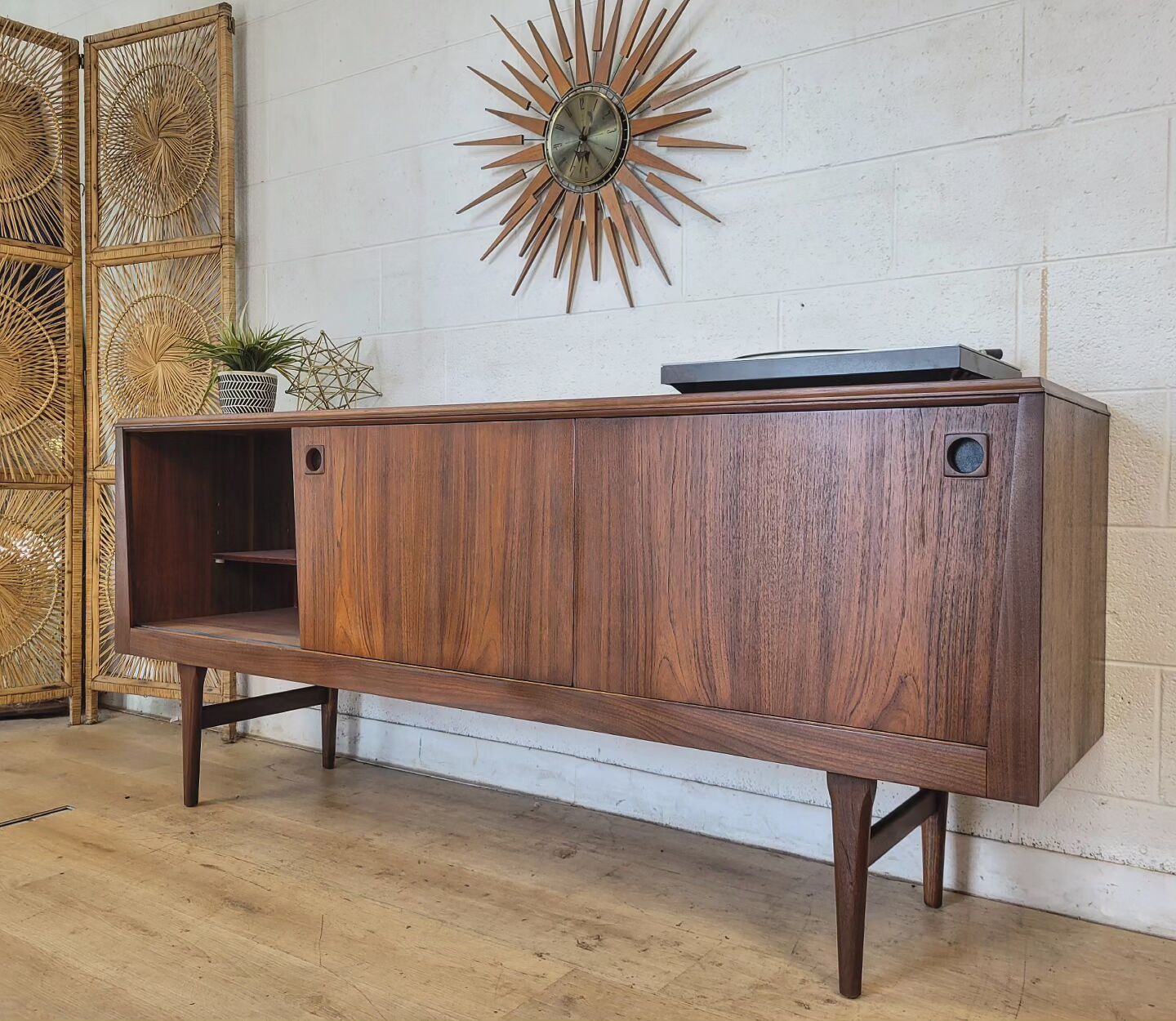 RHF Credenza with teak grain, tapered sides, and two shelves, giving an atomic vibe to home decor. Mid-century modern console.