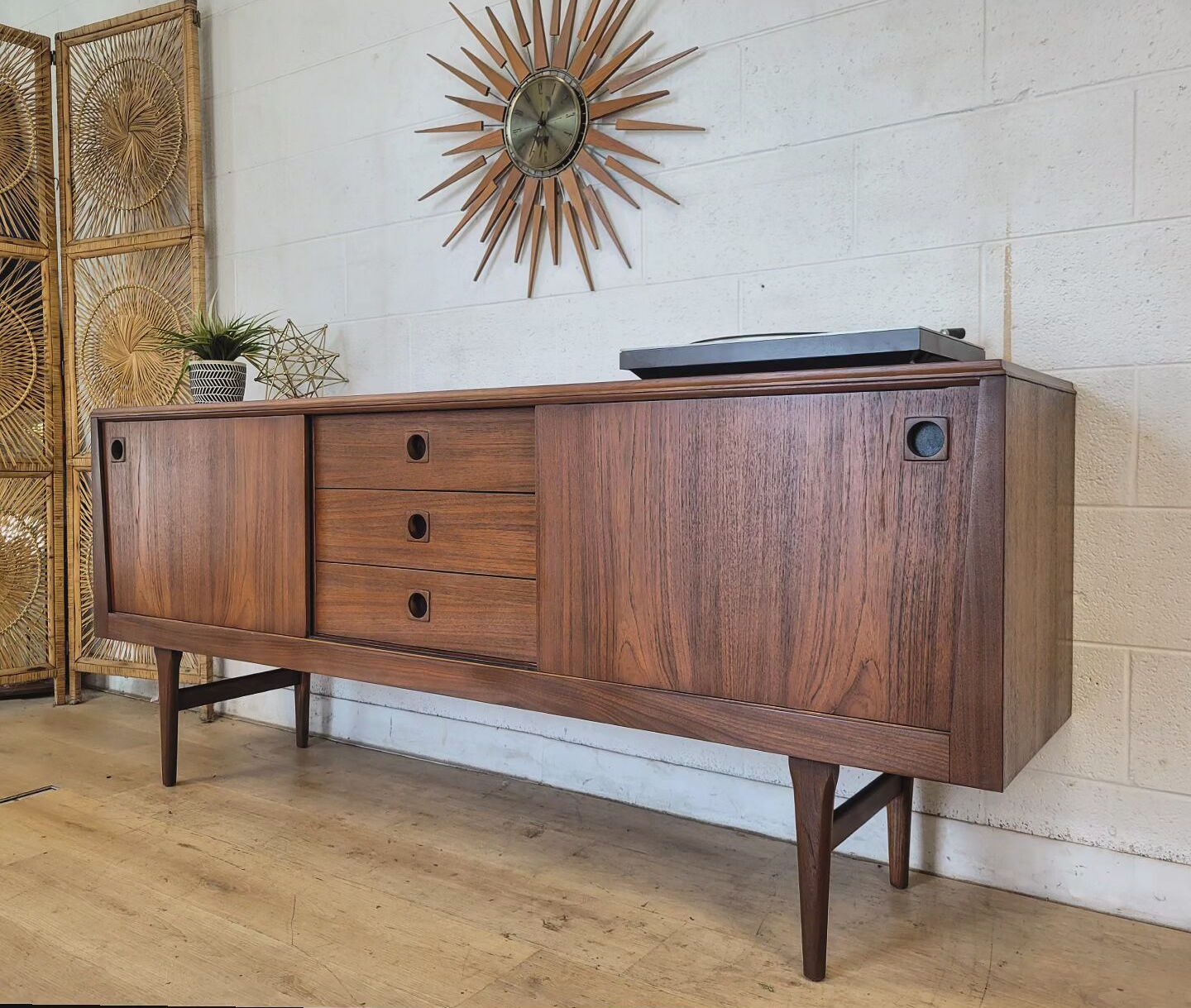 Mid-century modern teak RHF credenza with tapered sides, adjustable shelves, and atomic design, enhancing home decor.